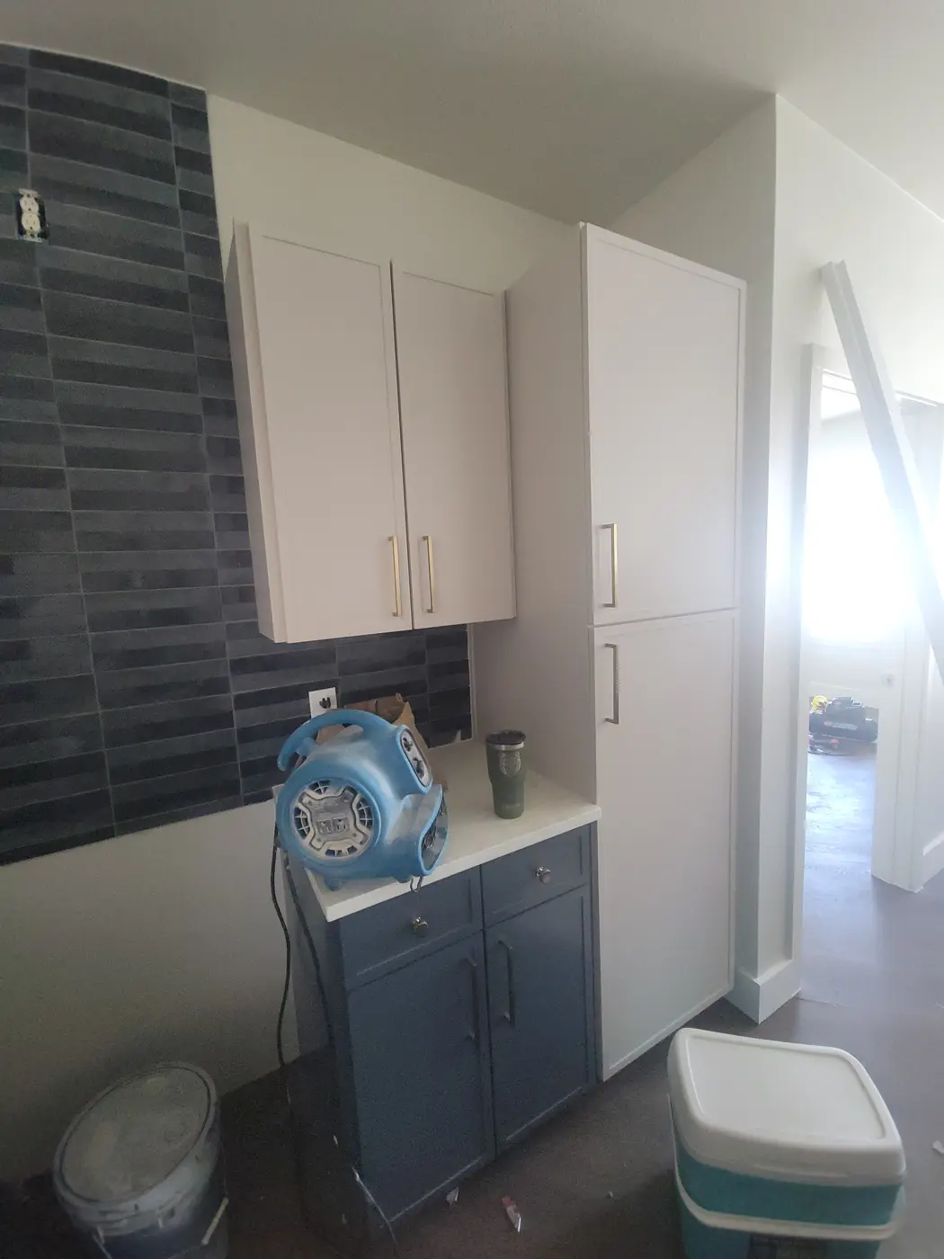 Cabinets and backsplash in a renovated apartment kitchen